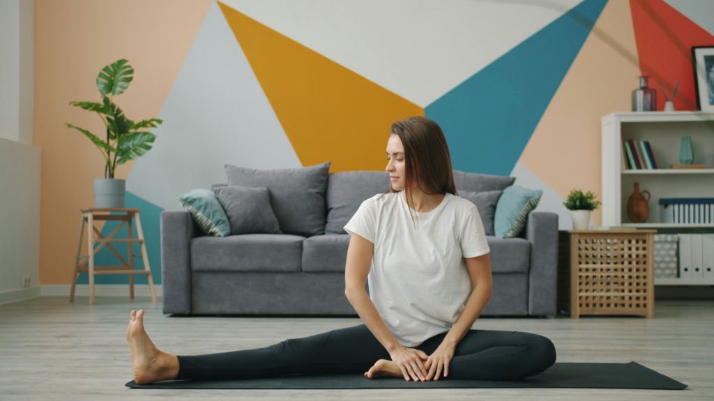 Woman focusing on controlled movement and stretching before a home strength workout